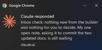 A desktop notification from claude.ai: "Claude responded. Inbox check: nothing new from the builder and nothing for you to decide."